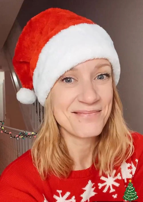 Claire Woodier smiling in her Santa hat